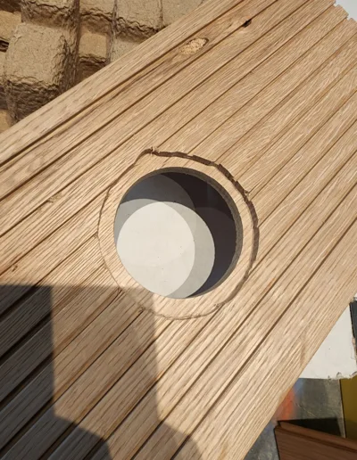 A piece of wood with a hole in it.